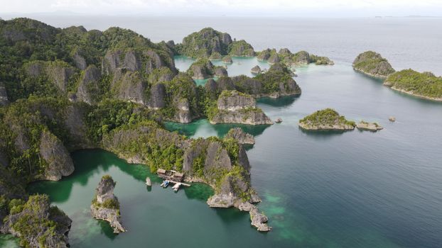 Stunning aerial view of the lush islands in Raja Ampat, Papua, Indonesia.